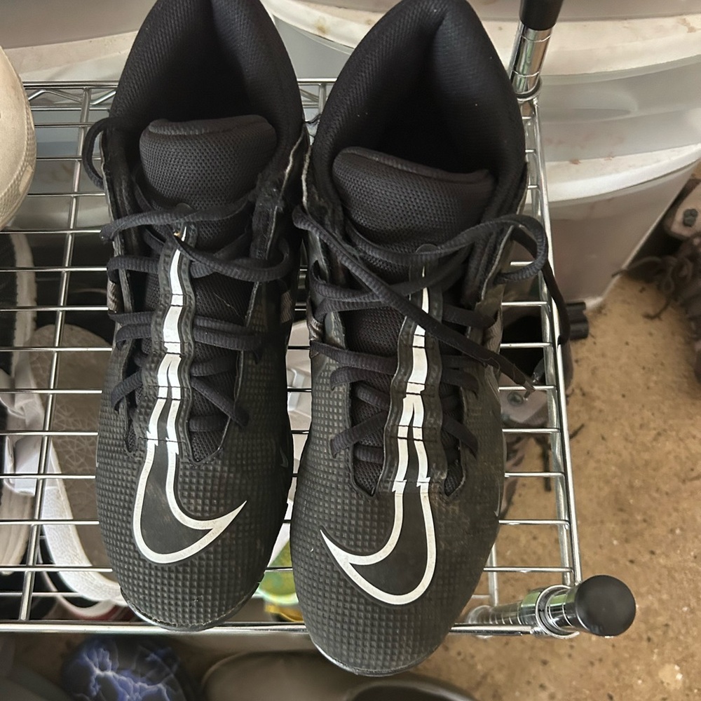 Nike high-top football cleats. 9.5 wide